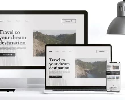 A website shown on laptop, tablet and phone screens