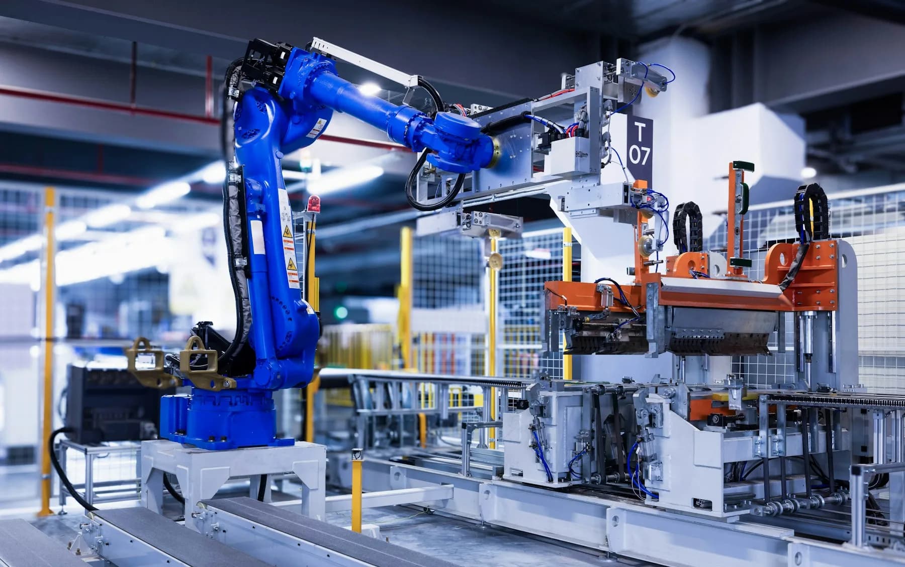 A robotic arm working on an automated factory line
